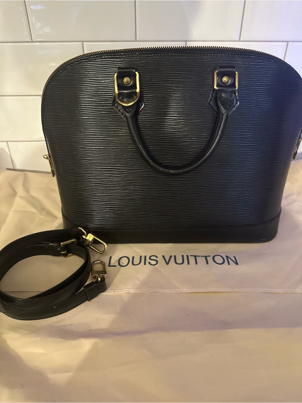 Authentic Louis Vuitton Black Epi Alma Satchel with Gold Hardware